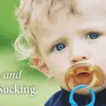 Pacifiers and thumb sucking - young toddler boy with pacifier in mouth