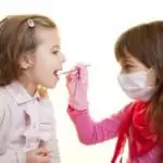 two girls playing dentist